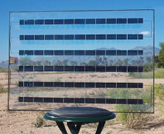 Так выглядит 25-ваттный модуль от Prism Solar. Как видим, собственно фотоэлектрические преобразователи занимают меньшую долю общей площади, но промежутки между ними, которые лишь выглядят как простое стекло — вовсе не лишние (фото с сайта nrel.gov).